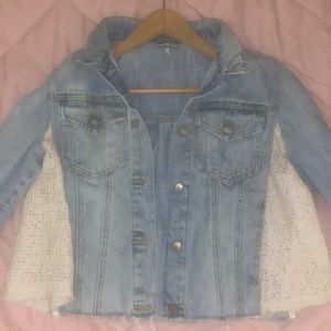 Free People loose cropped jean jacket with cream lace details .